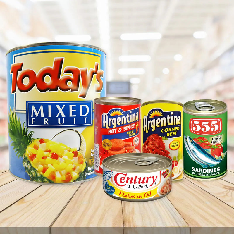 Canned goods assortment featuring Today's Mixed Fruit, Argentina Beef Loaf, Century Tuna, Argentina Corned Beef, and 555 Sardines on wood.