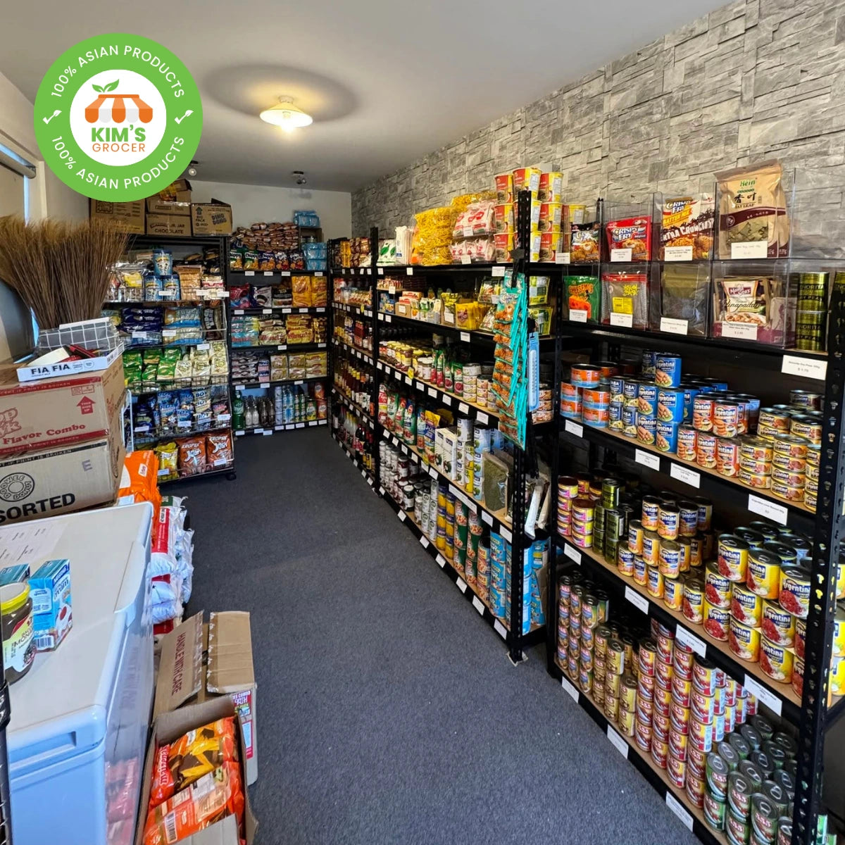 A colorful display of authentic Asian and Filipino snacks and groceries on wooden shelves at Kim’s Grocer in New Zealand.