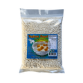 A bag of tapioca pearl next to a bowl filled with a colorful assortment of cooked vegetables and protein.