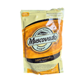 A jar of musovado natural sugar with jalapeño peppers, showcasing the unique blend of sweet and spicy flavors.