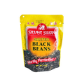 A close-up of silver swan black beans in a bowl, showcasing their glossy texture and rich color.