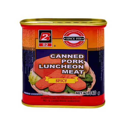Canned pork luncheon meat in a sauce, displayed on a wooden surface with a fork beside it.