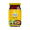 A bottle of Barrio Fiesta sauteed shrimp paste with a vibrant label showcasing its brand and flavor profile.