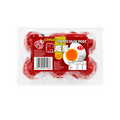 Plastic packaging containing eggs, featuring Chinese writing on the label.