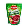 A pouch of tomato paste set on a white background, showcasing the product's rich red hue and branding.