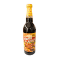 A glass bottle of barbeque marinade with a label reading "Mama Sita's," showcasing a homemade, inviting appearance.