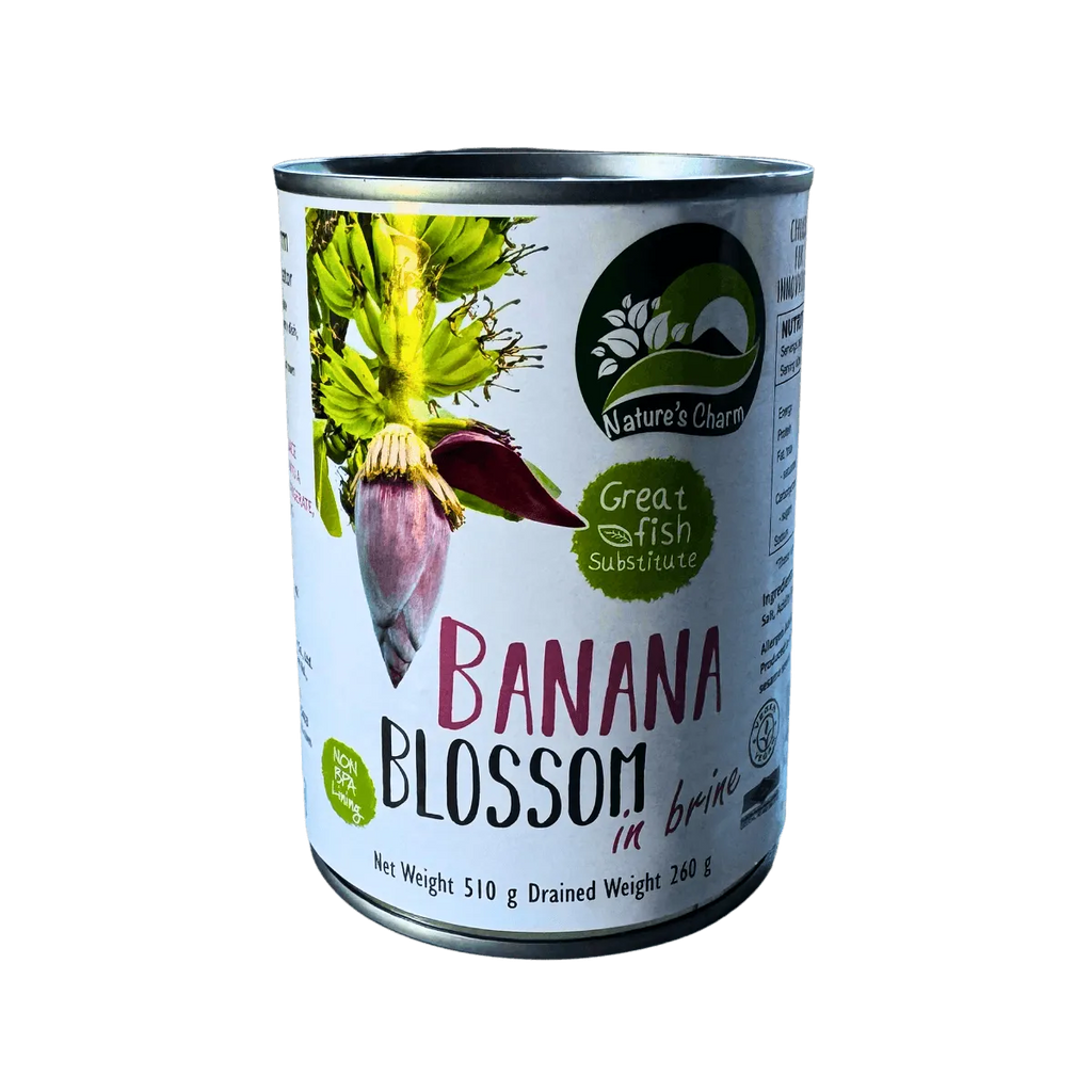 A can of banana blossom placed on a green leaf, showcasing its natural packaging and vibrant color contrast.