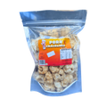 A plastic bag filled with spicy pork cracklings, showcasing its fluffy texture and buttery color.