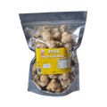 A clear plastic bag filled with golden-brown pork cracklings, highlighting their crunchy texture.