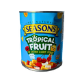 A colorful mix of tropical fruits including pineapple, mango, and coconut arranged in a bow