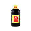 A bottle of soy sauce with a dark label, positioned against a black background.