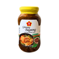 A jar of ginisang bagoong, showcasing the product's label and texture.