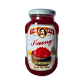 A jar of kaong red jelly displayed against a white background, showcasing its vibrant color and texture.