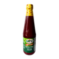 A bottle of ketchup with a red label, placed against a solid white background.