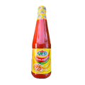 A bottle of banana catsup with a vibrant label, set against a sleek black background.