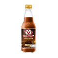 A bottle of vitamilk stands upright against a solid black background.