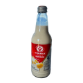 A bottle of milk featuring a white label with red accents, standing upright against a neutral background.