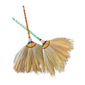 Two brooms adorned with vibrant ribbons, showcasing a festive and decorative design.