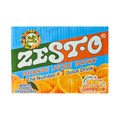 A box of Zest-O orange juice with a vibrant orange color, placed on a wooden table, surrounded by fresh oranges.